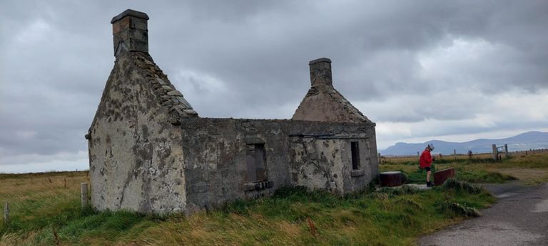 Moin(e) House, built in the same year as the Duke of Sutherland's 1830 road as a refuge for travellers. This was the only road until the A838 was built in 1993. A family lived in the cottage for many years from 1881. Buildings at Risk and Canmore entries includes photos of it roofed. It lost this after 1987. http://cmy.iay.org.uk/moinehouse/moine.htm &  https://www.buildingsatrisk.org.uk/details/895346 & https://canmore.org.uk/site/5411/moin-house