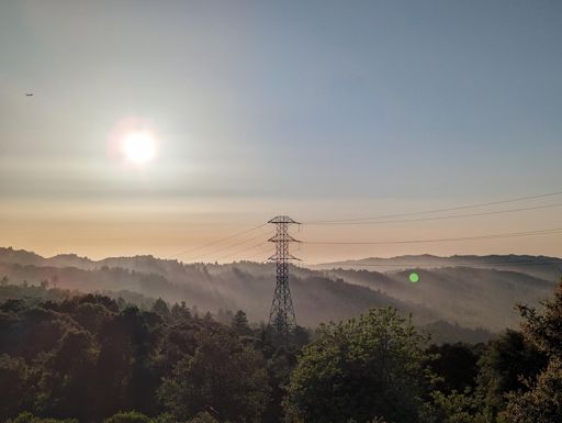 Some faint but neat sun rays beaming down on the hills.