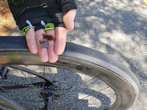 Rather than focusing on the negative, I decided to be positive.   quick "dad lecture/ how to change a tire" photo guide.     Step one go back and look for the cause of the flat and remove it for the next rider 🙂