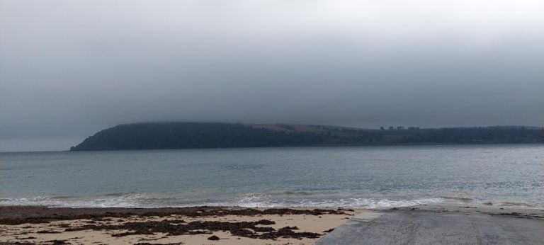 512ft/156m Gallows Hill shrouded in cloud above the Sutors of Cromarty headland.