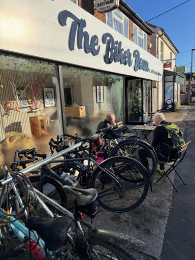 Relax, it's our sort of bikes! There's a bicycle stand outside and classic steel frame hanging in the window.