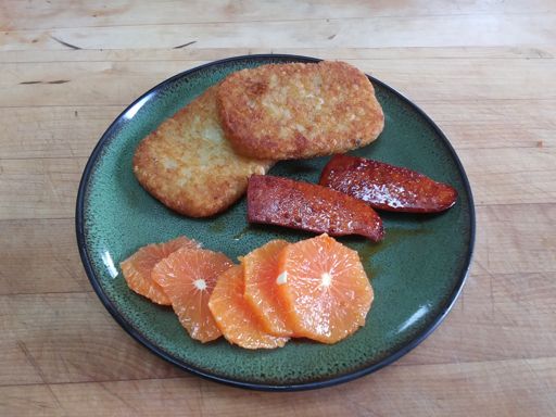 Hash browns cooked in schmaltz with linguica and oranges.  I earned it!