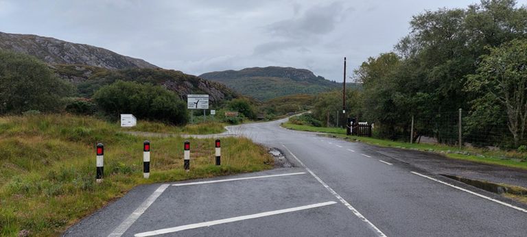 Approaching Laxford Bridge. Road atlas font size suggests population, rather than the single driveways in the photo, one either side of the A838! The slatted white lines are narrowing the road.
