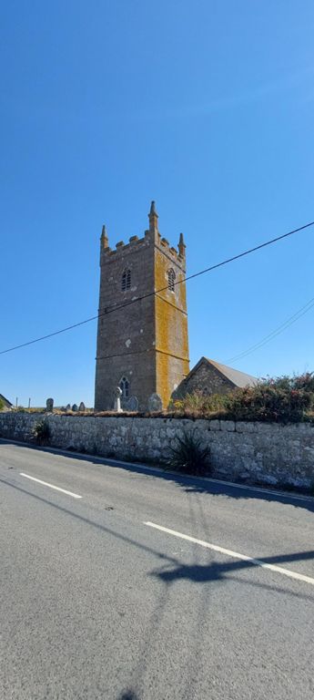 Sennen church with no sign. 

About Sennen including the church: https://en.wikipedia.org/wiki/Sennen