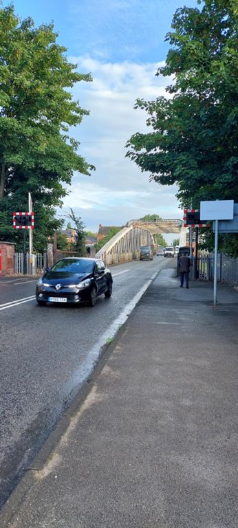 South of the bridge over the Manchester Ship Canal.