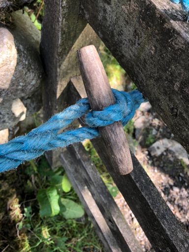 Simply solve this Chinese rope puzzle to get gate open