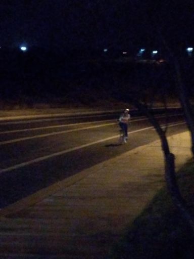 Woman riding in a bintage Bic pen jersey that she got at a thrift store and didnt realize it was a real pro team back in the day.