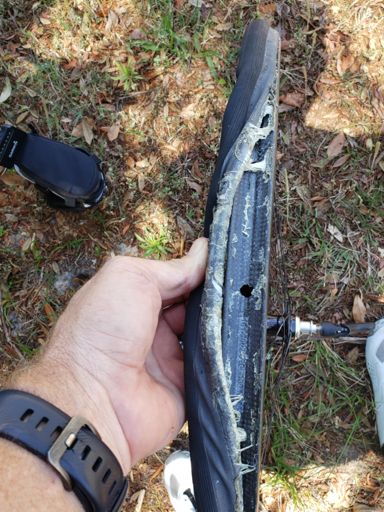 Usually I keep a disposable glove or two in my bag but not today.  For tubular tires; I make sure to deflate 100%, begin to remove the tire from the rim at the 180 degree point from the valve stem.