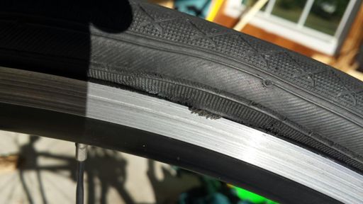 Frayed bead on rear tire... Caused two flats! Time for a new tire... And some new tubes...