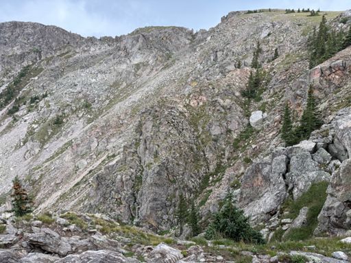 0.3 miles from summit, but the thunder is rocking!  Instead of getting exposed on the ridge, we will bushwhack through trees to cut over to the ski trails.