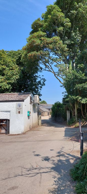 By the Philleigh Inn, which wasn't on our list of break stops as it opened after I expected us to be there. I called in here to ask for water. Google Maps names it Philleigh Way Cookery School. A group was having a short course on pastry making. I circled round and entered the kitchen where Julie was very accommodating. On the way back, I thought I recognised an American man we'd talked to in Marazon on Thursday, and whispered to him. Yes, it was him, and the two ladies beside him. In a trice and for a brief moment, I had the floor and described what had happened to the trainer. Good wishes all round and a quick departure.