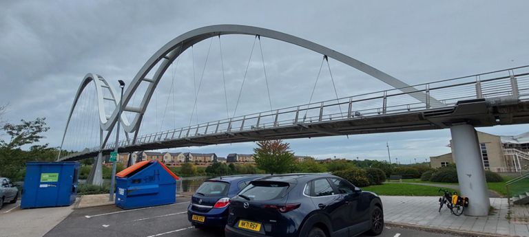 Infinity Bridge opened 2009.  This website's photo shows its splendour: https://expedition.uk.com/project/infinity-bridge/ 
&   as do photos in Wikipedia's entry:  https://en.wikipedia.org/wiki/Infinity_Bridge