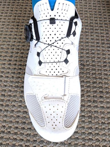 My pretty white shoes all splattered with sealant