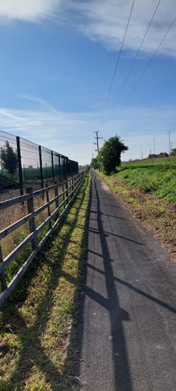 Cycle path to its south
