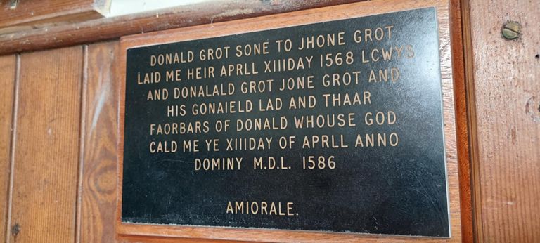 What does it say? 

Google Translate cannot detect the language and set to Dutch does not translate it. 

Perhaps: Donald, son of John, was laid to rest on 13th April 1568, and maybe a son or daughter also on 13th April 1586.??