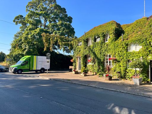 Is there a more English scene than a 15th century pub and a Waitrose van?