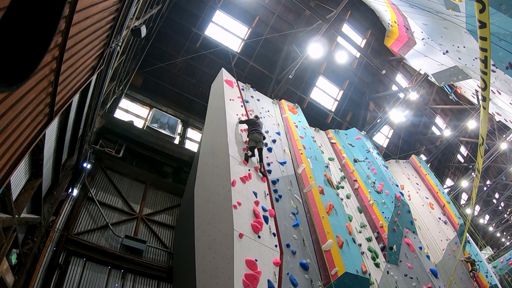Climb 2 - Pink 5.10a (F): This interesting route stands on the far left side of the Grotto Left wall.  The wall here features a continuous slight overhang, and the holds while large were directional in a few spots, requiring a little more care with technique and body placement.  The hardest part of the climb was the starting moves.  For me getting my left leg past the large triangular volume that sticks out from the wall at waist level was the hardest move.