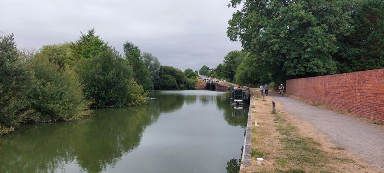 4m43s video of cycling down these locks is in the Photos album, accessible on https://www.cycling4charity.org.uk

Bottom of Devizes' main run of Caen Locks designed by John Rennie the Elder who also designed a pier for Berwick we pass on Day 49.  Built between 1796 and 1810.

https://en.wikipedia.org/wiki/Caen_Hill_Locks