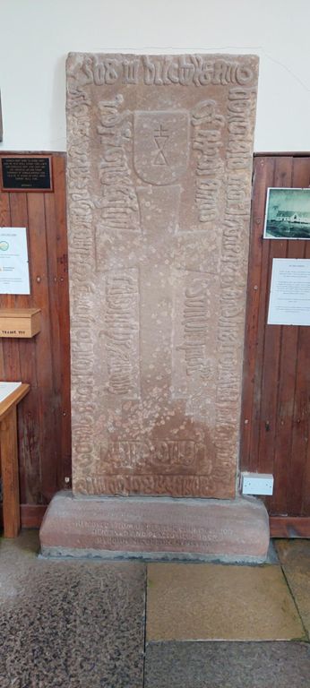 De Groot family tombstone, found under the floor during renovations, is in the entrance. The Wikipedia entry says John De Groot is buried in the church's graveyard.