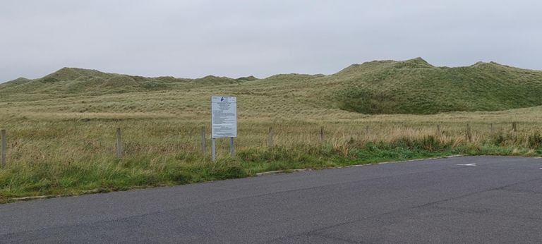 We found no signs indicating what they are, which is a national Site of Special Scientific Interest. The dunes and their specific grasslands stretch 1.9 miles / 3 km inland:
https://sitelink.nature.scot/site/572