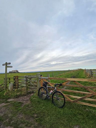 Snow on the Cheviot in the distance. Lindisfarne Castle to the left.
