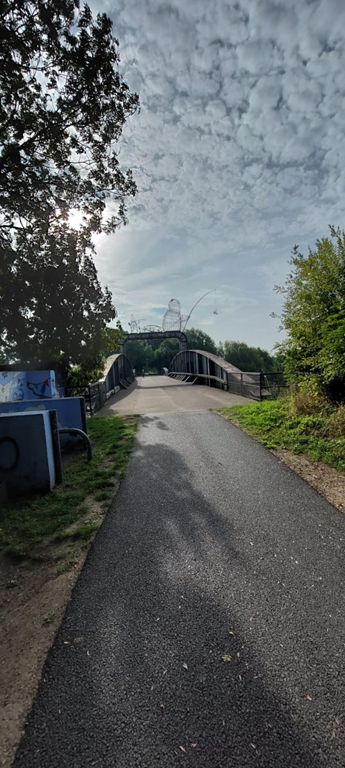2001 "Fisher of Dreams" sculpture  < https://statues.vanderkrogt.net/object.php?webpage=ST&record=gbyh082 > on Naburn Railway Bridge over the River Ouse, part of the Cycle the Solar System Greenway, part of Route 65 and Trans Pennine Trail, formerly part of London to Edinburgh East Coast Main Line built by North Eastern Railway.   Info and useful videos on these route websites: https://railwaytogreenway.org & https://hedgehogcycling.co.uk/york-to-selby-cycle-route.html