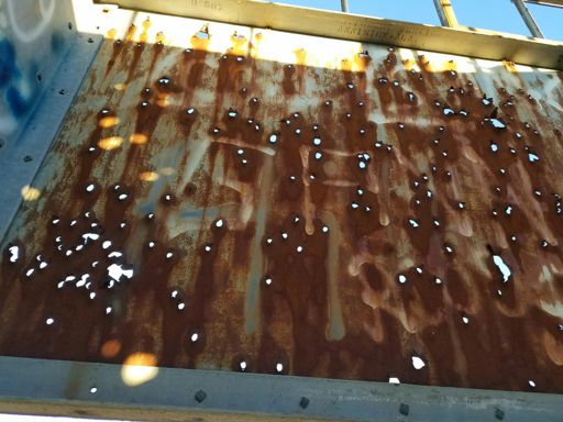 Yes, those are bullet holes. Lots of hunting in this area and I guess they use the tower for target practice.