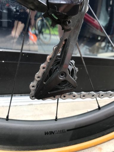 Chain somehow found its way out of the cage...luckily was an easy roadside fix.