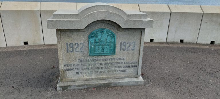We assumed this sign related to an earlier sea wall constructed 1922-23 to relive unemployment. This sea wall looks relatively new.