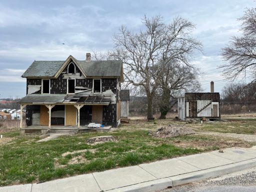 The property with the tree.