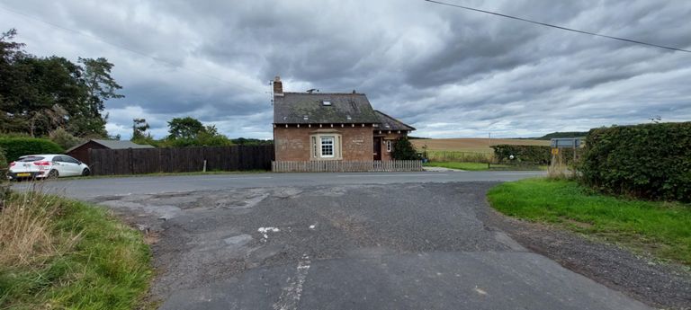 Skaithmuir Toll, former toll house, on the A6112.   I think it was somewhere before this we met a spread-out group of Newcastle lads who had been battling their way against the wind towards Edinburgh for 2 days. https://www.geograph.org.uk/photo/2028725