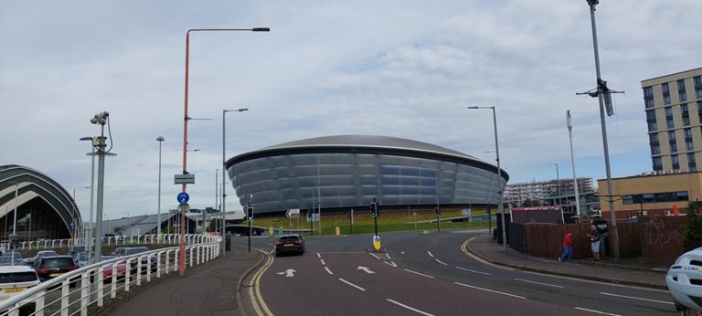 Ovo Hydro multi-purpose venue - mainly for concerts, designed by Foster and Partners. "Hydro" - from Scottish Hydro Electric.  "Ovo" - from its new Ovo Energy sponsor.  https://en.m.wikipedia.org/wiki/OVO_Hydro