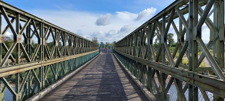1948 (Bailey) Broom of Moy footbridge and the 2013 extension with the young woman and her dog. She had said the closer bridge had been built by two local men...  https://www.geograph.org.uk/photo/2304139  - read note for this and 2 other linked photos  &  https://www.forres-gazette.co.uk/news/bridge-re-opens-across-the-river-findhorn-104625/  &  https://www.youtube.com/watch?v=4Ud-DSvVCQI -  Drone video puts it in context. NCN Route 1 turned left over rough ground after the bridge. Explore going straight. Perhaps to a better surface sooner.