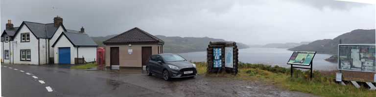 Loch Inchard as seen from Rhiconich, a hamlet with a police station contrasting it with towns in England. 4 miles from here to the sea. About the hamlet: https://en.wikipedia.org/wiki/Rhiconich. About the loch: https://wikishire.co.uk/wiki/Loch_Inchard