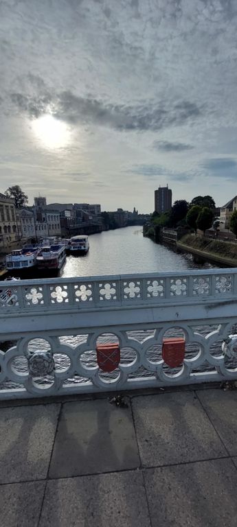 Looking south east down the River Ouse from the 1863 Lendal Bridge.  http://www.historyofyork.org.uk/themes/victorian/lendal-bridge#:~:text=Lendal%20Bridge%20is%20an%20iron,and%20the%20lions%20of%20England.