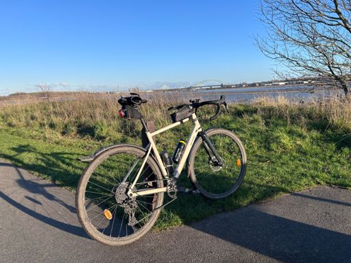 Standard mug shot leaning on post