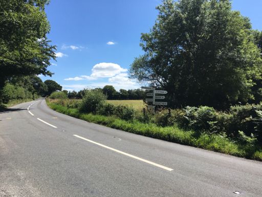 Top of Angersleigh climb with a sign pointing in six different directions!