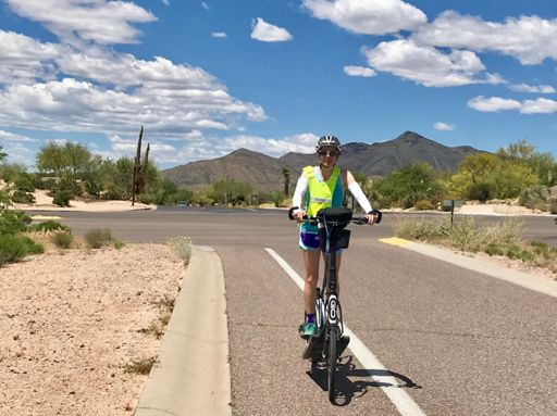 Anna happy to turn out of the headwind & to finish our big climb!
