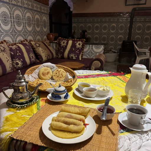 My plan for this tour is to stay in Riads where possible. 
( I obvs have my wee tent for a back up) A Riad is a traditional Moroccan house with one front door leading into a court yard  generally to a fountain or garden area with the accommodation wrapped around.
Cheap, clean and very accommodating.
This one cost me £26 with this feast of a breakfast included. Fully expected
not to get my breakfast as I was leaving early but Ahmed wouldn’t here of it. He chapped my door at 5.50am and told me the fire was on and breakfast on and breakfast on its way.