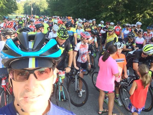Ride start.  On my left, George Hincapie tells a bunch of kids about riding in the Tour de France.  They were 't interested in my banking stories....