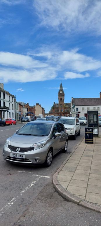 Annan high street, where we stopped for food. Lorraine went to a farmers market. Ralph went to a bakery for an excellent coffee, a haggis pie and quiche, both yummy. Public facilities in the 1878 town hall, where the tower is, were used.  About Annan: https://en.wikipedia.org/wiki/Annan,_Dumfries_and_Galloway  And its town hall: https://en.wikipedia.org/wiki/Annan_Town_Hall