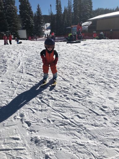 Baby girl has a skier stance