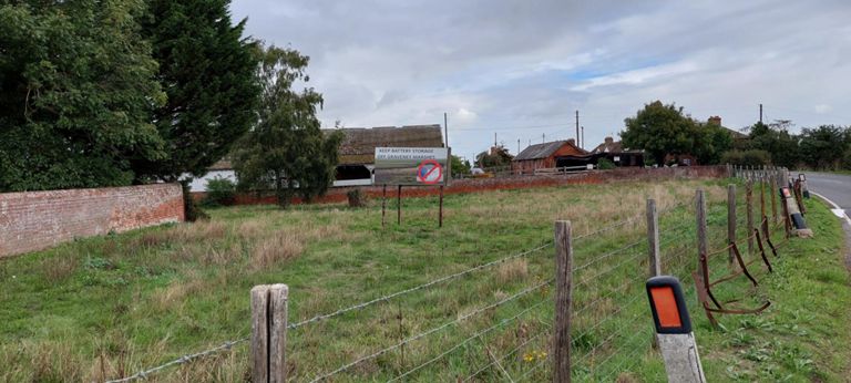 Sign beside the church: "Keep battery storage off Graveney Marshes" https://savegraveneymarshes.org