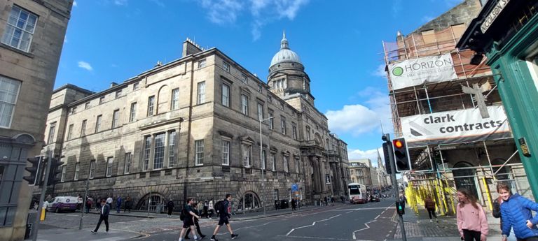 University of Edinburgh, Old College, within South Bridge, South.. & West College St and Chambers St - lack of funds and a war with France delayed its completion. Largely built in two phases: 1789-93 and 1815-34, the dome added in 1887.  Canmore entry includes lots of photos. https://canmore.org.uk/site/52400/edinburgh-south-bridge-university-of-edinburgh-old-college