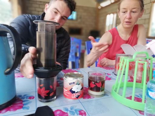 Emma coaches Phillip on how to make the perfect aeropress.