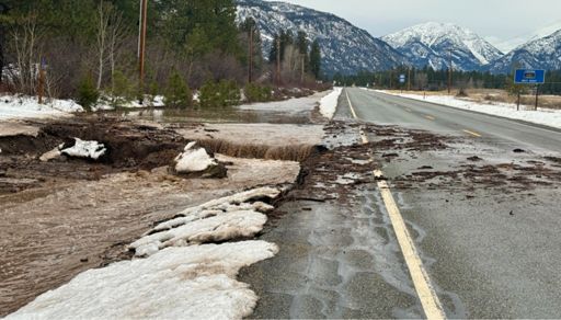 Flooding from Looney Creek has taken out several driveways and crossed the road a little.
