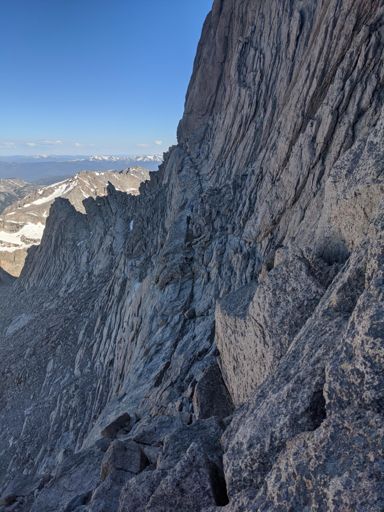 Looking back across the path, the two climbers in the photo show the path across.