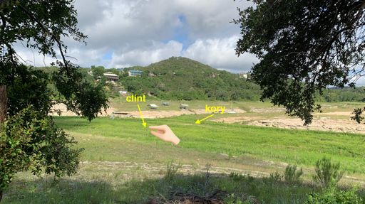 clint+kory (so far away!) doing recon to see if the lake was cross-able. it was, much further out of frame to the right... muddy+marshy+overgrown in lots of other spots.