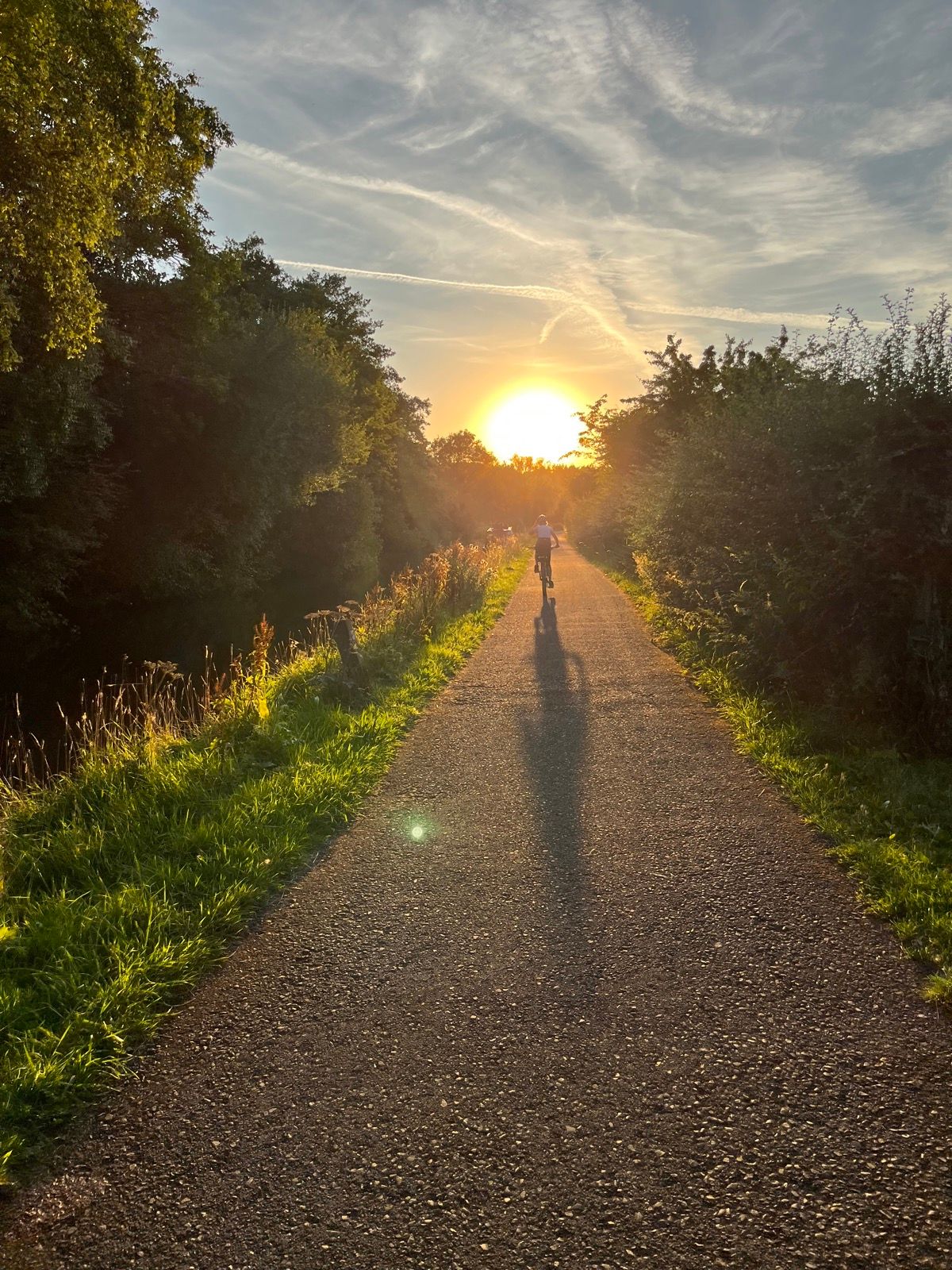 Cycling home along the canal towpath into the setting sun