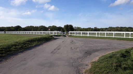When the tarmac runs out turn left onto the firm gravelly track. Do not cross the racecourse.